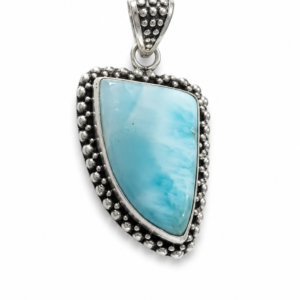 Melia Handcrafted sterling silver pendant featuring natural larimar gemstones in an elegant botanical artisan design. Handmade in Bali by Aretodia.